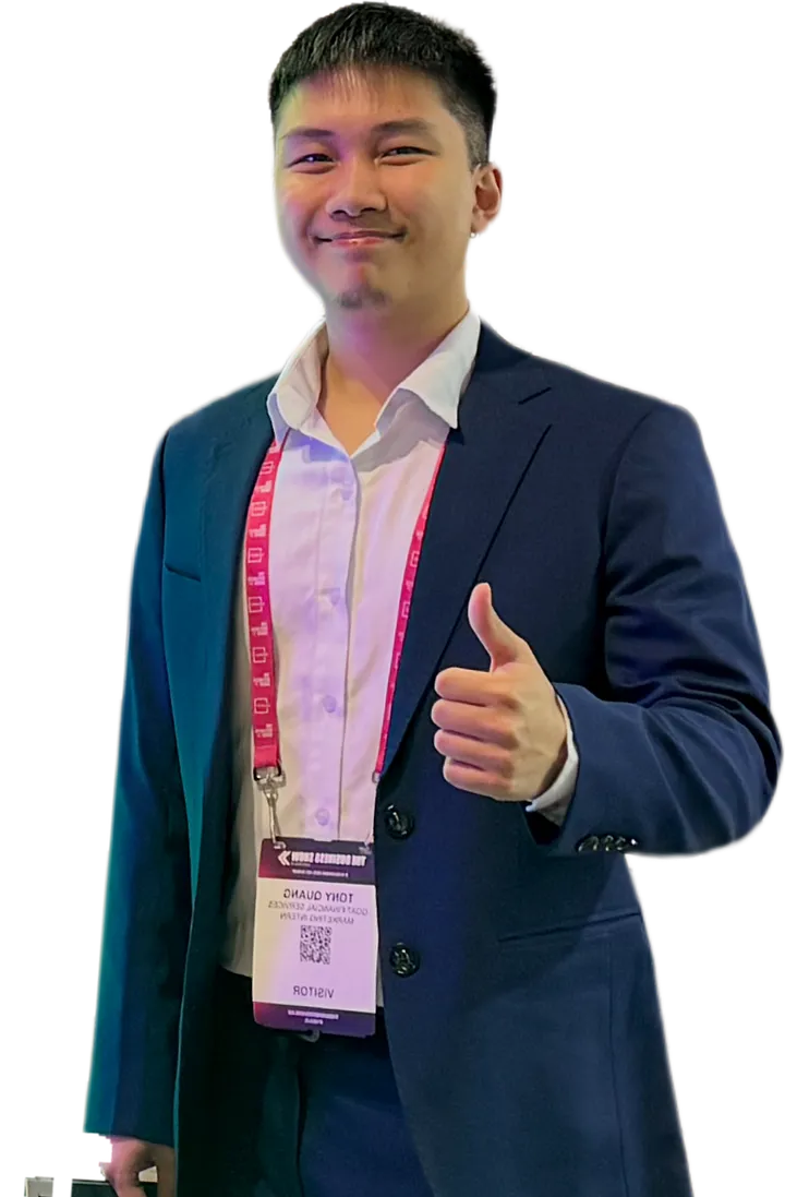 Tony Quang smiling in a navy suit